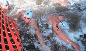 Pro men scramble through the shallows.